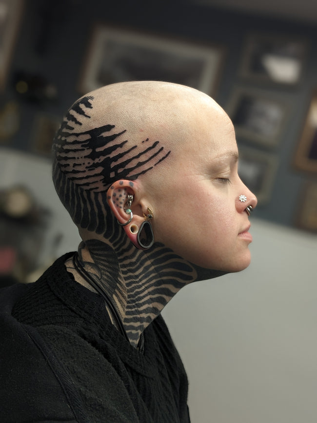 bioorganic industrial head tattoo – abstract pattern design, heavy blackwork detail