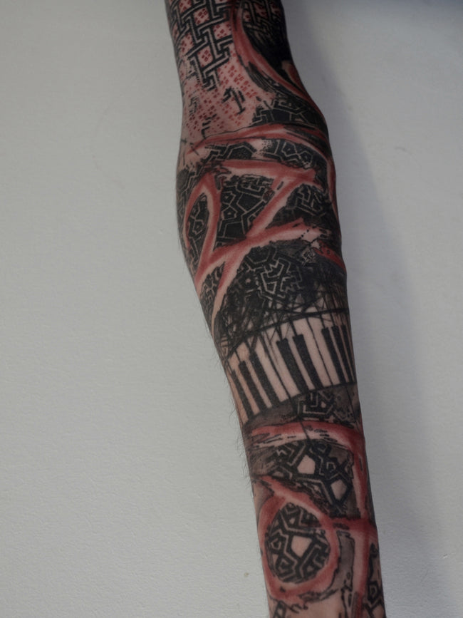 bioorganic industrial sleeve tattoo – full arm abstraction, street art-inspired blackwork