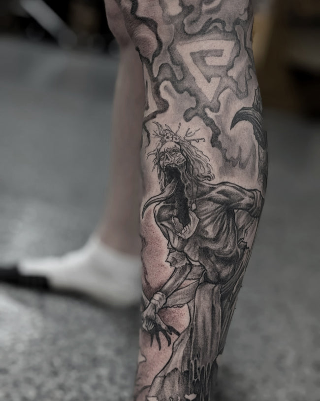 black and grey Witcher tattoo detail – hyperrealistic leg sleeve close up