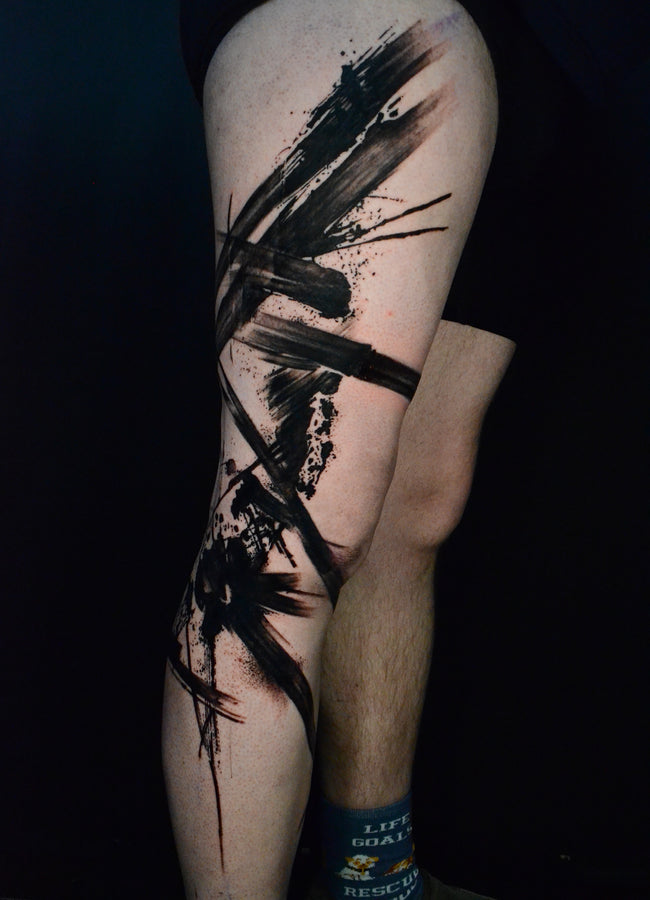 heavy black abstract trash polka leg sleeve – expressive brush strokes and ink splash design
