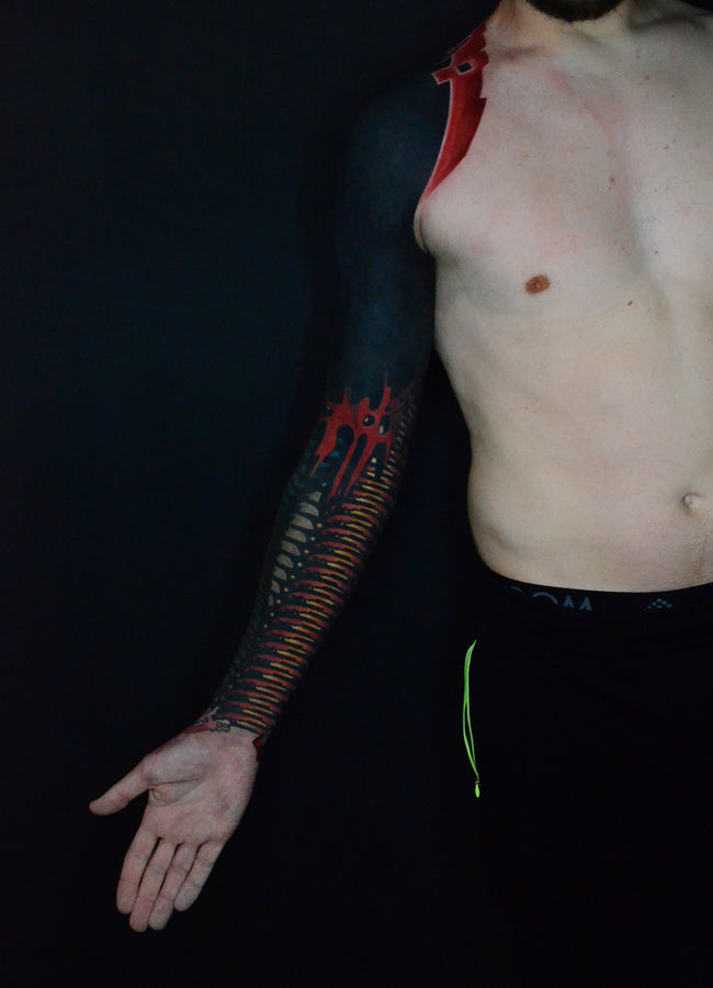 bioorganic industrial blackout tattoo – cover up with contrasting color and black abstraction