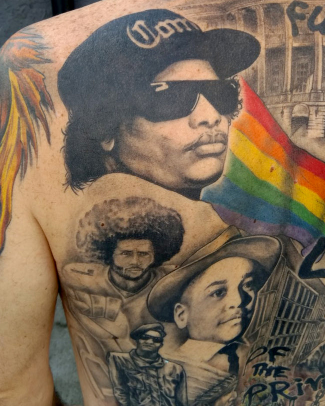 realistic back portraits tattoo – Eazy-E, Colin Kaepernick, Emmett Till, Black Panther, rainbow flag elements