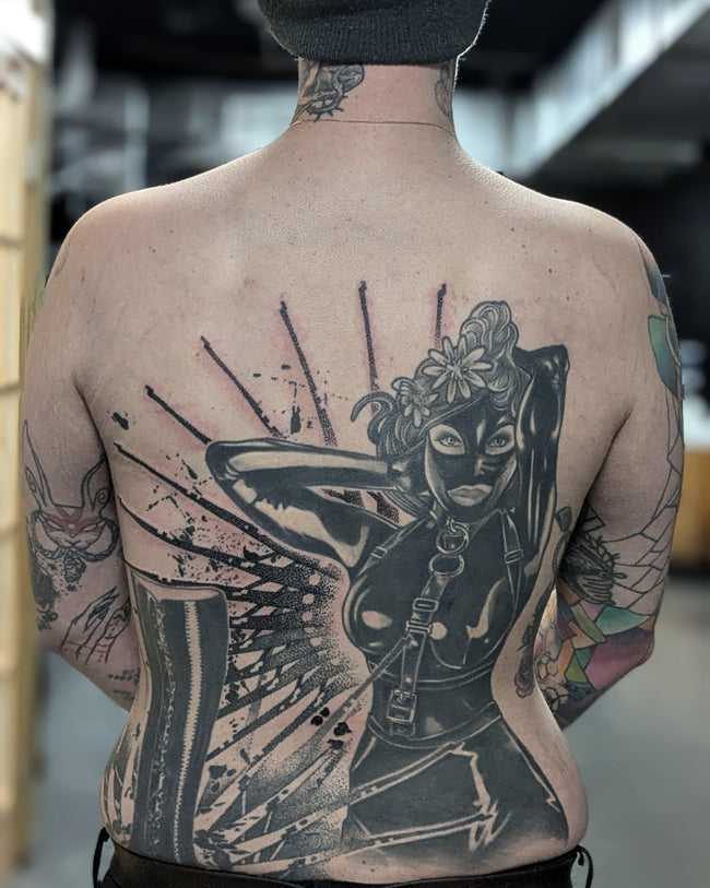 realistic industrial pin-up back tattoo – Alfons Mucha inspired figure with heavy industrial pattern background