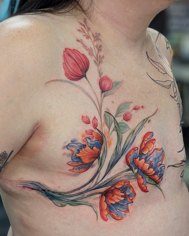 watercolor chest tattoo – full color floral composition covering mastectomy scars