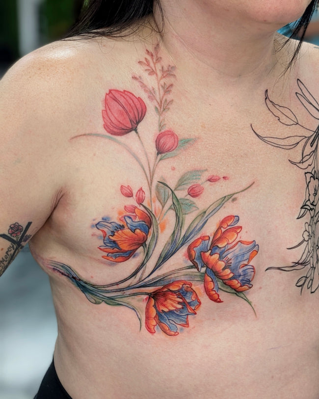 watercolor floral tattoo – chest composition in full color covering mastectomy scars