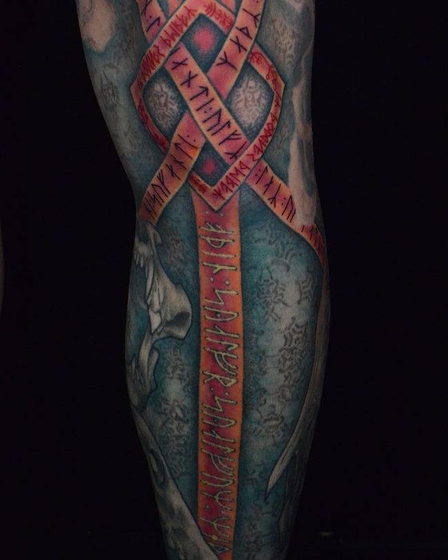 full color Nordic leg sleeve tattoo – Odin theme with spear runes, illustrative detail