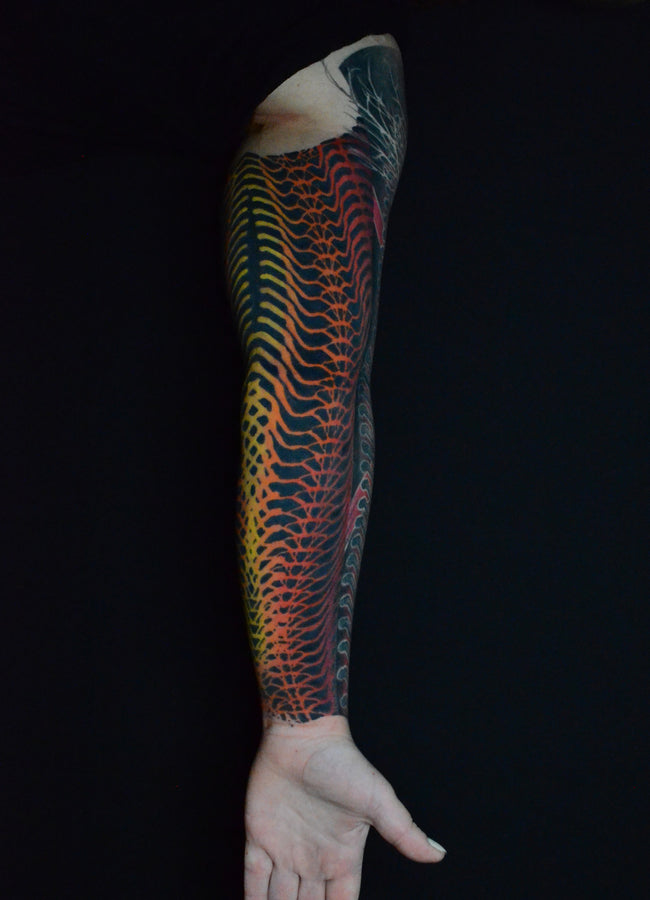 bioorganic industrial sleeve tattoo – black dotwork industrial pattern with contrasting colors, nature inspired