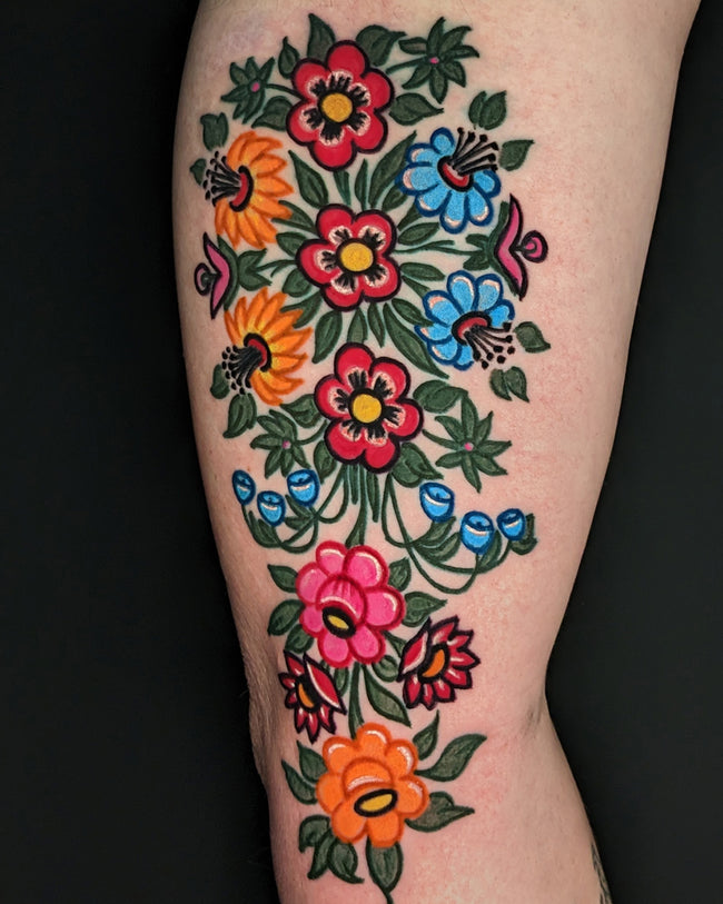 traditional Polish floral tattoo – Zalipie village inspired full color design on arm