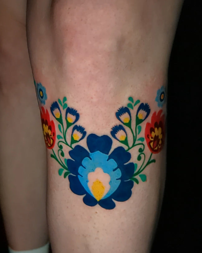 Polish folk floral tattoo – wycinanka style full color on leg