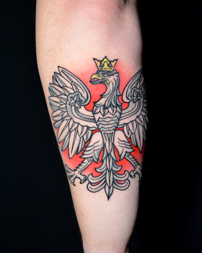 Polish national emblem tattoo – white eagle with crown on red background, forearm