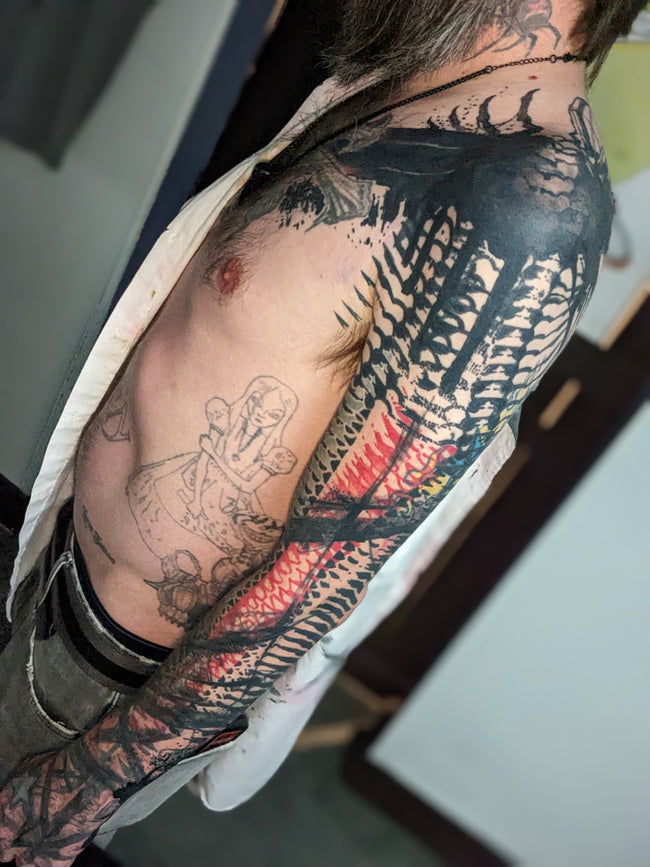 bioorganic industrial blast-over sleeve – heavy black and red patterns, full arm