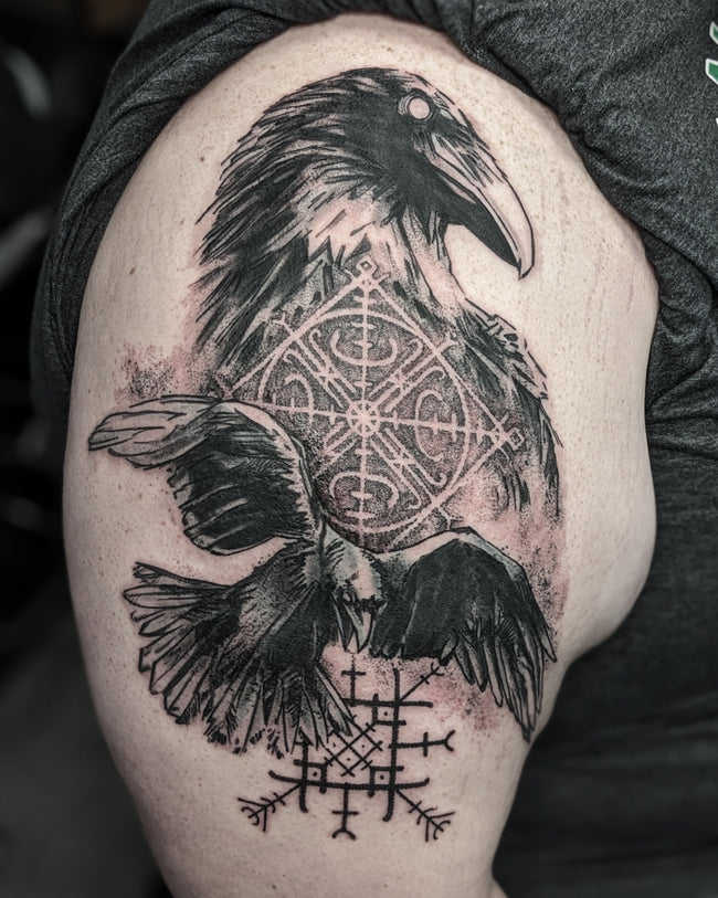illustrative Viking tattoo – black and grey shoulder design with runic sigils and ravens Huginn and Muninn