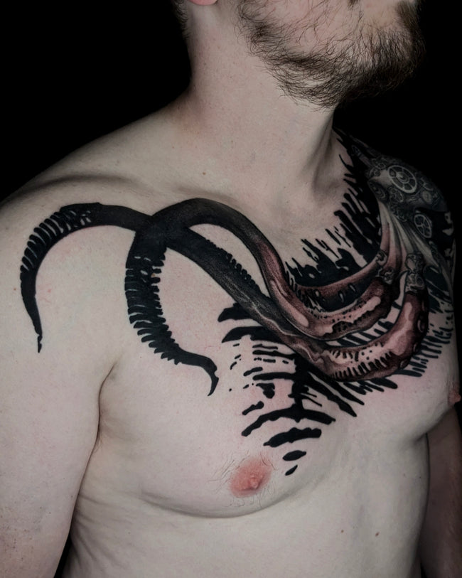 illustrative realistic steampunk octopus tattoo – black and grey with heavy industrial pattern background, chest detail