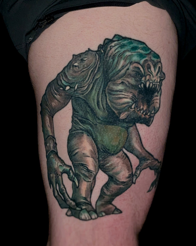 graphic illustrative Star Wars leg tattoo – Rancor creature design